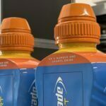 Oversized Lucozade sport bottles rear lids close up